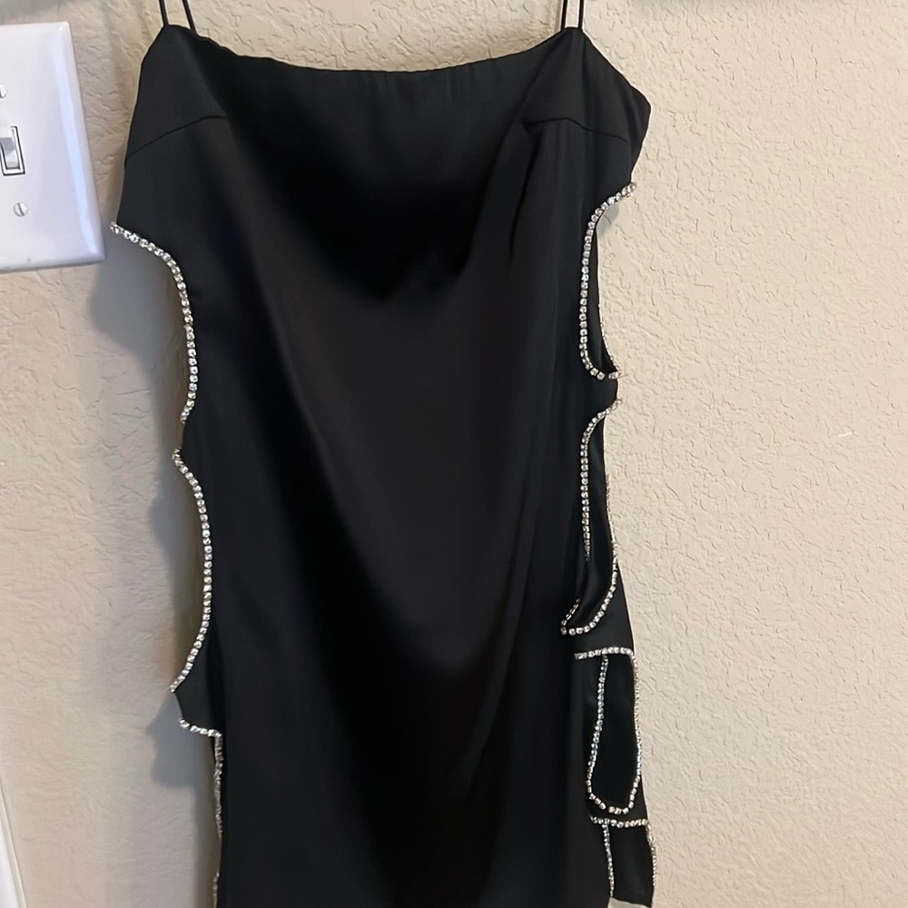 Mini black going out dress with cut sides bedazzled with diamonds